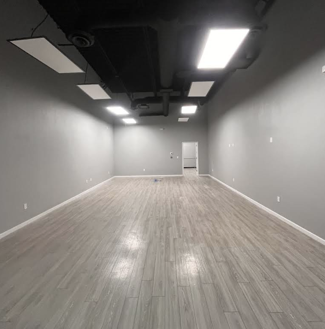 Open commercial room with recessed lighting