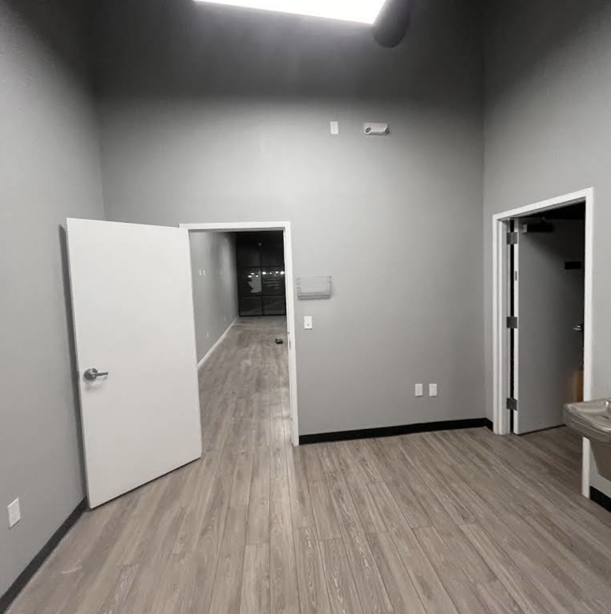 Office room with doors and gray walls